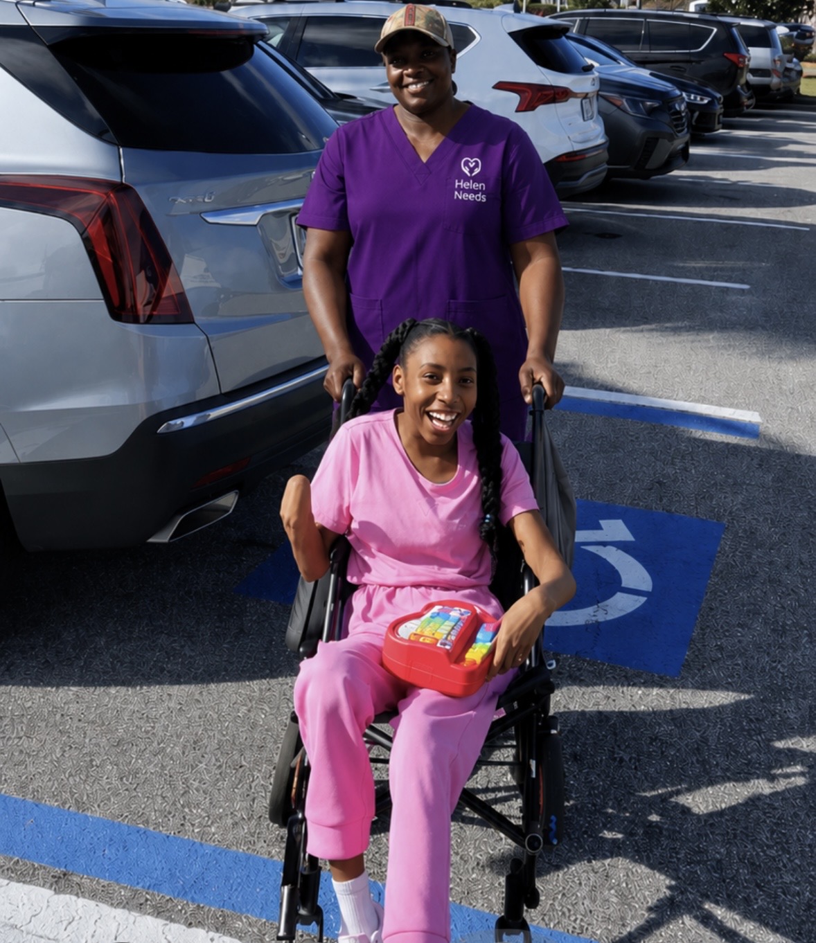 Breyata Battle smiling outdoors with a community member